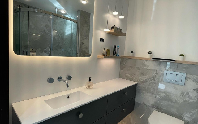 Large Wall Hung Vanity Unit LED Mirror And A Back To Wall Toilet