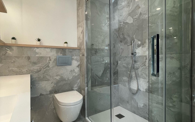 Offset Quadrant Sliding Door Shower Enclosure And Back To Wall Toilet